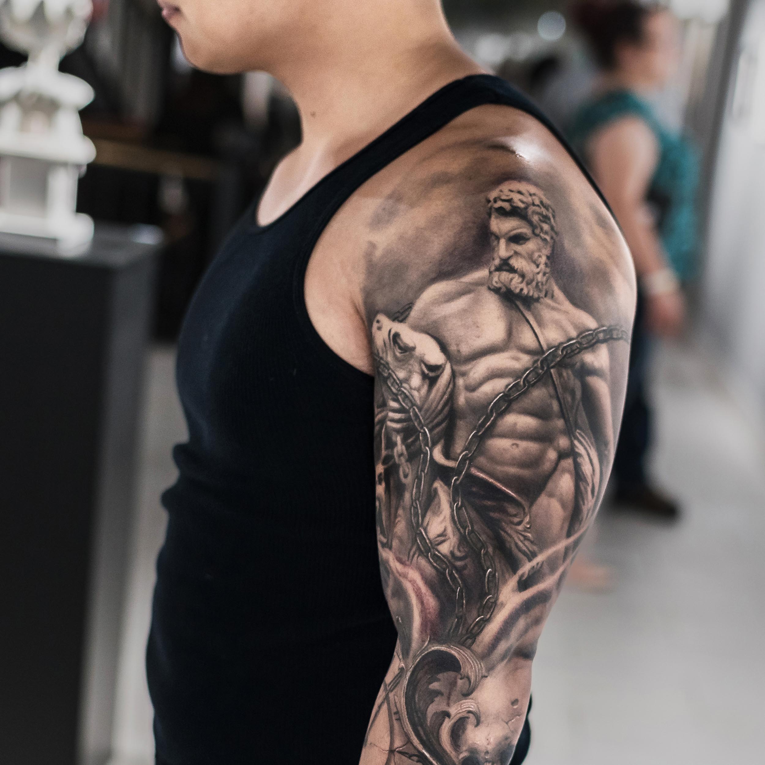 Realistic tattoo of Hercules on the arm.